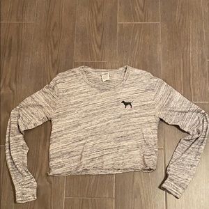 I’m selling a Grey and white PINK(brand) shirt.